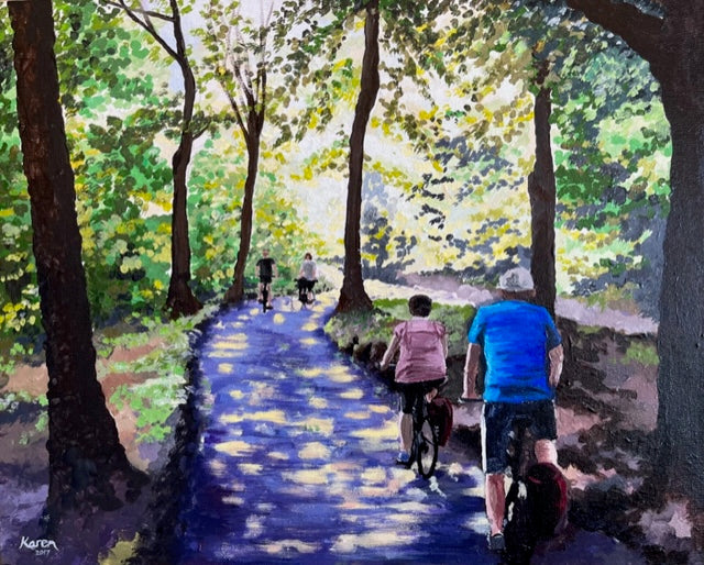 Cyclists on a woodland path