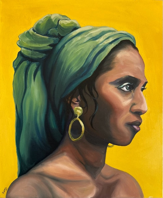 Woman with green headscarf and gold earring